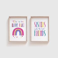 two framed pictures with the words sisters and rainbows in different colors, hanging on a wall