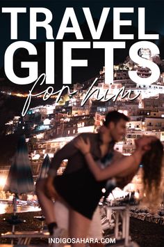 a man and woman kissing in front of a cityscape with the words travel gifts on it