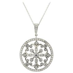 A lovely diamond pendant made in 18k white gold. It features a total of 2.16 carats of round brilliant-cut diamonds set around the pendant in stylish patterns. There are smaller rounds set on the border of the medallion while larger stones are set in the middle of the pendant in its filigree pattern. Made in 18k white gold and ready to be worn! Pendant Length: 1.6 inches Chain Length: 18 inches Weight: 12.4 grams Elegant Medallion Diamond Necklace With Diamond Accents, Exquisite Diamond Necklace With Intricate Design, Round Diamond Necklace With Intricate Design, Fine Jewelry Diamond Necklace With Intricate Design, Luxury Round Diamond Necklace With Rose Cut Diamonds, Luxury Rose Cut Diamond Necklace In Platinum, Luxury Platinum Necklace With Rose Cut Diamonds, Intricate Round Diamond Necklace, White Gold Diamond Necklace With Rose Cut Diamonds