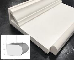 an image of a sheet of white paper on the floor with measurements for it to be cut