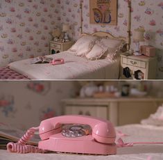 an old pink phone sitting on top of a bed next to a wallpapered bedroom