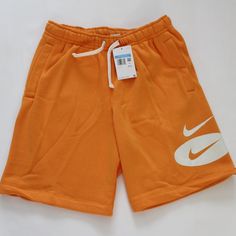 Nike Above-Knee Length Shorts Color: Orange Standard Fit Elastic And Drawstring Waist Side Seam Pockets Back Patch Pockets Knit Construction Fleece Interior Body: 80%Cotton, 20% Polyester Machine Washable Waist Sizing: S=29-32", M=32-35", L=35-38" True To Size S: Rise 11.5", Inseam 8.5" M: Rise 12.5", Inseam 9" L: Rise 13", Inseam 9" Msrp $50 Casual Nike Shorts For Summer, Nike Short Leg Bottoms For Summer, Orange Short Bottoms For Loungewear, Orange Short Loungewear Bottoms, Nike Cotton Shorts For Summer, Leisure Sportswear Shorts For Spring, Orange Loungewear Bottoms With Built-in Shorts, Spring Leisure Sportswear Shorts, Nike Shorts For Summer Loungewear