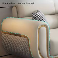 a white couch with pillows on it in front of a wall that says diamond and titan handrail