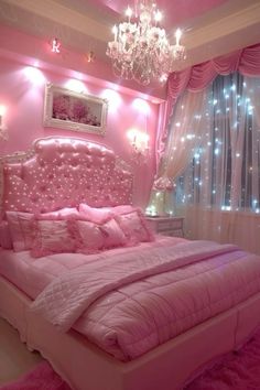 a bedroom decorated in pink and white with chandelier above the bed, lights on either side