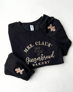 Black and gold sweatshirt with Mrs. Claus& Gingerbread Bakery embroidered on the front and gingerbread men details on the sleeves. Green Sweatshirt, Men Sweatshirt, Winter Essentials, Christmas Fashion, Black Colour, Gingerbread Man