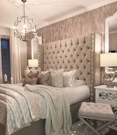 an instagram photo of a bedroom with a chandelier above the headboard