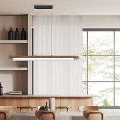 a dining room table with chairs and bottles on the shelves next to it in front of a large window