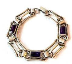 Vintage Art Deco Purple Stone Bracelet Sterling Silver Amethyst Glass Link Bracelet 1930s Antique Estate Jewelry Gift for Women Offered is an antique Art Deco sterling silver bracelet set with emerald cut purple amethyst glass stones. Marks: "K&B Sterling" Age: 1920s-1930s Measurements: 7 inches long Condition: It is in overall very good condition, consistent with age. Items are vintage or antique and may have slight signs of gentle use as would be expected. Silver and silver plated items are ha Magnified Images, Bracelet Set Silver, Art Deco Bracelet, Bracelet Sterling Silver, Purple Stones, Art Deco Jewelry, Vintage Bracelets, Antique Art, Stone Bracelet