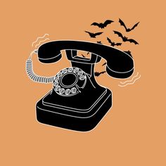 an old fashioned phone with bats flying around it