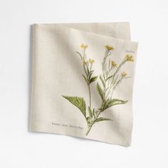 two napkins with yellow flowers on them