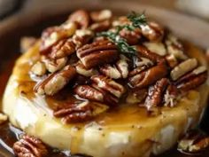 a plate topped with bananas covered in pecans