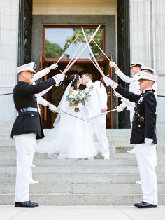 the bride and groom are getting ready to walk down the stairs at their wedding ceremony