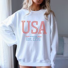 This USA Sweatshirt is perfect for the 4th of July, Independence Day, Memorial Day or Veteran's Day. This patriotic red, white and blue 1776 hoodie is an American winner!  Ideal for any situation, a unisex heavy blend crewneck sweatshirt is pure comfort. These garments are made from polyester and cotton. This combination helps designs come out looking fresh and beautiful. The collar is ribbed knit, so it retains its shape even after washing. There are no itchy side seams on these sweaters.  .: 50% cotton, 50% polyester .: Medium-heavy fabric (8.0 oz/yd² (271.25 g/m .: Loose fit .: Sewn-in label .: Runs true to size Air Clothes, Fourth Of July Party, Usa Party, 4th Of July Parade, Usa Sweatshirt, Veteran's Day, Paris Inspired, July Party, Usa Flag