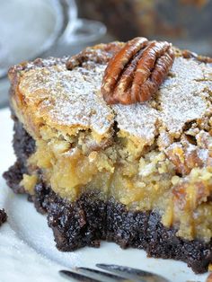 a piece of pecan pie on a plate with a fork