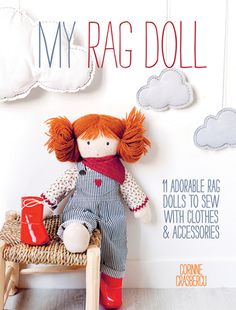 the cover of my rag doll book is shown with a red haired doll sitting on a stool