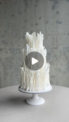 a white cake sitting on top of a table