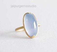 DESCRIPTION :- Chalcedony ring, 925 Sterling Silver chalcedony Ring, natural Chalcedony ring, Oval chalcedony ring, blue and silver chalcedony ring Material: Solid Sterling silver  Stone :- Chalcedony  stone size:- 12X16 mm 925 stamped Handmade item Our products are totally handmade and made with high quality gemstones and sterling silver. -If you believe in buying top quality products for yourself and for your family and friends -Jaipurgemsstudio is the place where you want to be There are uniq Blue Chalcedony Ring, Natural Emerald Rings, Handmade Sterling Silver Rings, Chalcedony Stone, Chalcedony Ring, Ring Blue, Ring Oval, Agate Ring, Art Deco Ring