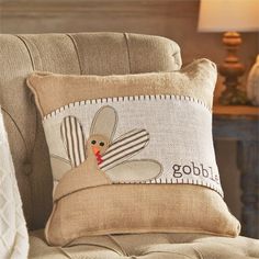 a decorative pillow with a turkey on it