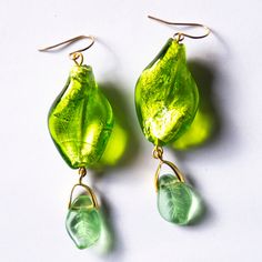 Leaf beads earrings, lampwork glass beads, unique piece Unique piece in golden steel.  6cms long. Green Drop Earrings With Unique Variations, Gold Glass Earrings With Dangling Beads, Unique Gold Glass Earrings, Green Recycled Glass Dangle Earrings, Elegant Handmade Murano Glass Earrings, Handmade Multi-strand Czech Glass Beads, Colorful Multi-strand Czech Glass Beads, Lampwork Earring, Multi-strand Polished Czech Glass Beads