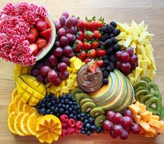 a variety of fruits are arranged on a platter