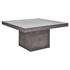 the concrete table is square and has an interesting shape