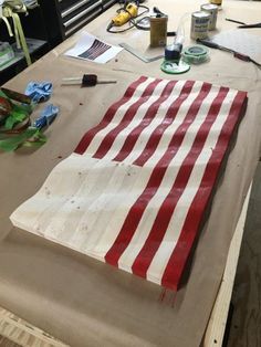 an american flag is being made on a table