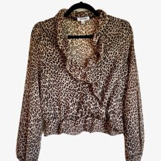 Steve Madden Sheer Long-Sleeve Cheetah Print Ruffle Blouse - Us Size M Condition: Nwot - Never Been Worn Fabric: 100% Polyester Detail: Ruffled Trim, Elastic Cuffs & Waist, Front Snap Button Closure, Flounce Hem, Hand-Wash Shoulder To Waist: 17.5" Sleeve Length: 23" Comes From Smoke-Free Environment. Cheetah Print, Ruffle Trim, Snap Button, Steve Madden, Ruffle Blouse, Hand Wash, Womens Tops, Sleeve Length, Trim