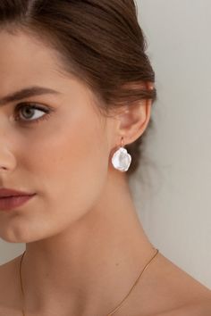 The Iris Pearl Earrings are handcrafted with baroque pearls-each pair is completely unique. They're paired simply with a 14k gold-filled ear wire to accentuate each pearl's natural beauty and charm.  Packaged in an elegant plastic-free reusable jewelry box, this necklace makes the perfect gift or special treat for oneself.   *14k gold-filled ear wires *Freshwater carved pearls (approximately 21-23mm height) *Hypoallergenic, suitable for even the most sensitive skin *Delivered in a 100% silk jewe Delicate Baroque Pearl Earrings With Pearl Charm, Delicate Baroque Pearl Earrings, Delicate Baroque Pearl Earrings For Pierced Ears, Delicate Baroque Pearl Teardrop Earrings, Delicate Baroque Pearl Drop Earrings, Garnet Heart, Money Images, Silk Jewelry, Real Pearls