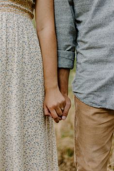 an image of a couple holding hands