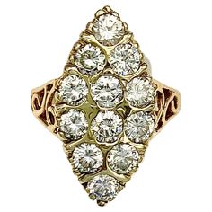 This cluster ring was made out of 18 karat red and yellow gold in the 1880's. The yellow gold ring head is set with 12 round old cut diamonds. The beautiful ring gallery has been executed in pierced work The red gold ring shoulders have been decorated with pierced scroll ornaments. The ring has been sized down in the past and has lost the 1 of the imprinted 18 karat. Vintage Red Multi-stone Diamond Ring, Antique Multi-stone Yellow Gold Cluster Ring, Luxury Multi-stone Vintage Ruby Ring, Victorian Multi-stone Yellow Gold Diamond Ring, Vintage 14k Gold Multi-stone Ruby Ring, Antique Diamond Rings, Antique Diamond, Cluster Ring, Antique Rings