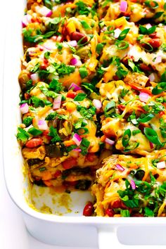 a casserole dish filled with vegetables and cheese