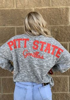 Display your Pitt State Gorillas spirit in this Pitt State Grey T-Shirt! This Pitt State Cozy Long Sleeve T-Shirt makes a great layer for cooler nights cheering on the Gorillas. Featuring a screen print, this Pitt State Gorillas Long Sleeve LS Tee is a must-have for any fan. Always a Gorilla! Super Soft Feel, Oversized Body, Drop shoulders, Chest Seam, Ribbed Cuffs, Screen Print Graphics, 67% POLY/30% RAY/3% SPAN Oversized Collegiate Long Sleeve Top, Oversized Long Sleeve Collegiate Tops, Collegiate Oversized Tops For Loungewear, Pitt State Gorillas, Oversized Tops For College In Fall, Oversized Fall Tops For College, Collegiate Long Sleeve Loungewear Top, Collegiate Long Sleeve Tops For Loungewear, Oversized Collegiate Winter Tops