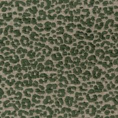 an animal print fabric with green spots