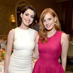 two beautiful women standing next to each other