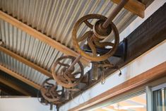 an image of the inside of a building with metal fixtures hanging from it's ceiling