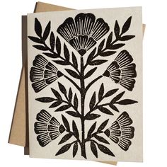 a card with black and white flowers on it