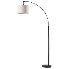 a black floor lamp with a white shade on the base and a round light fixture