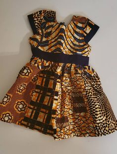 Dress your little diva up to look like the real African Princess she is in our Authentic African Print dress. Available in a size 4, 5 and 6 Multicolor Fitted Dress For Dress-up, Yellow Short Sleeve Dress For Dress-up, Orange Cotton Party Dress, Fitted Cute Orange Dress, Fitted Short Sleeve Twirl Dress For Party, Fitted Twirl Dress With Short Sleeves For Party, Cute Fitted Orange Dress, Cute Fitted Brown Dress, Fitted Cotton Twirl Dress For Party