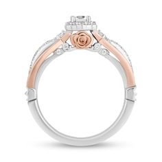 an engagement ring with two tone gold and white diamonds on the sides, set in 18k rose gold