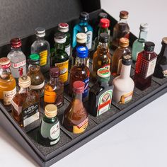 an assortment of liquor bottles in a black case