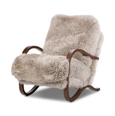 a rocking chair with sheepskin on it