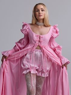 This dress is like stepping out of the pages of a Jane Austen novel. Its delicate pink hue, reminiscent of the blush of a woman who fell in love, captures the grace of Regency-era fashion. The fabric flows gently, evoking the timeless charm of old English gardens, making you feel part of a romantic and enchanting world. A-line maxi train dress with in casual glamour style. By untying the ties of the dress, it can easily be turned into a shawl and worn as a top layer over everyday clothes. The dr Pink Wedding Dress With Gathered Sleeves, Pink Billowy Dress For Spring, Pink Midi Dress With Ruffles And Fitted Bodice, Pink Billowy Dress For Daywear, Elegant Pink Dress With Gathered Sleeves, Billowy Pink Feminine Dress, Pink Dress With Gathered Sleeves For Daywear, Fitted Marie Antoinette Style Spring Dress, Marie Antoinette Style Fitted Spring Dress