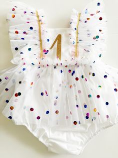 "This beautiful birthday romper is handmade to order.  Dress is sleeveless with a ribbon tie-back design. This dress is delicately crafted to last for years and years to come.  *Ribbon colors and notions cannot be changed due to high order volume around holidays. Turn around time is around 2- 3 weeks, please be prepared to receive the items closer to end of the estimated delivery window but feel free to leave the date needed in the \"notes to seller\" box at the checkout.  If you need to rush an order please reach out via Etsy message to see if we can accommodate the date needed.  Care instructions: HAND-Wash or dry clean only, do not iron tulle fabric, hang the dry to dry. Steam may be used on tulle fabric, Cotton Skirt can be ironed on low heat setting.  Due to the handmade nature, this Spring Party Bubble Romper With Ruffles, Summer Party Bubble Romper With Ruffles, Sleeveless Bubble Romper For Spring Birthday, Summer Princess Dresses For Celebration, Whimsical Summer Birthday Dress, Summer Birthday Bubble Romper With Ruffles, Sleeveless Bubble Romper For Parties, Playful Bubble Romper For Spring Party, Playful Party Bubble Romper For Spring