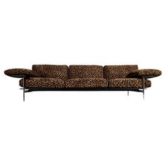 an animal print couch with metal legs