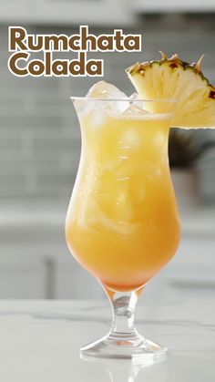 the rumchata colada cocktail is garnished with pineapple