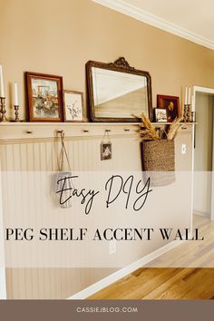 a fireplace with the words easy diy peg shelf accent wall above it and pictures on the mantle