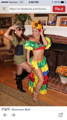 two women in costumes posing for the camera