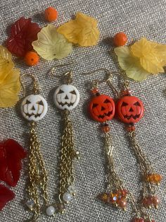 Delicate and sweet orange and white jack o lantern earrings Each pair of earrings have dangling gold chains with crystal attached . Orange Jack o lanterns have black and orange dangles too!These earring are perfect for Halloween or any other Fall event! **FREE GIFT OF another pair of seasonal earrings from my shop ♥️ White Drop Earrings For Halloween, White Dangle Jewelry For Halloween, Orange Dangle Earrings For Halloween, White Jack O Lantern, Lantern Earrings, Jack O Lanterns, Hippy Gifts, Fall Events, Black And Orange