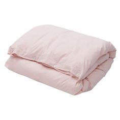 a pink comforter is folded on top of a white bed sheet and has buttons at the bottom