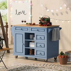 a blue kitchen island with an open shelf